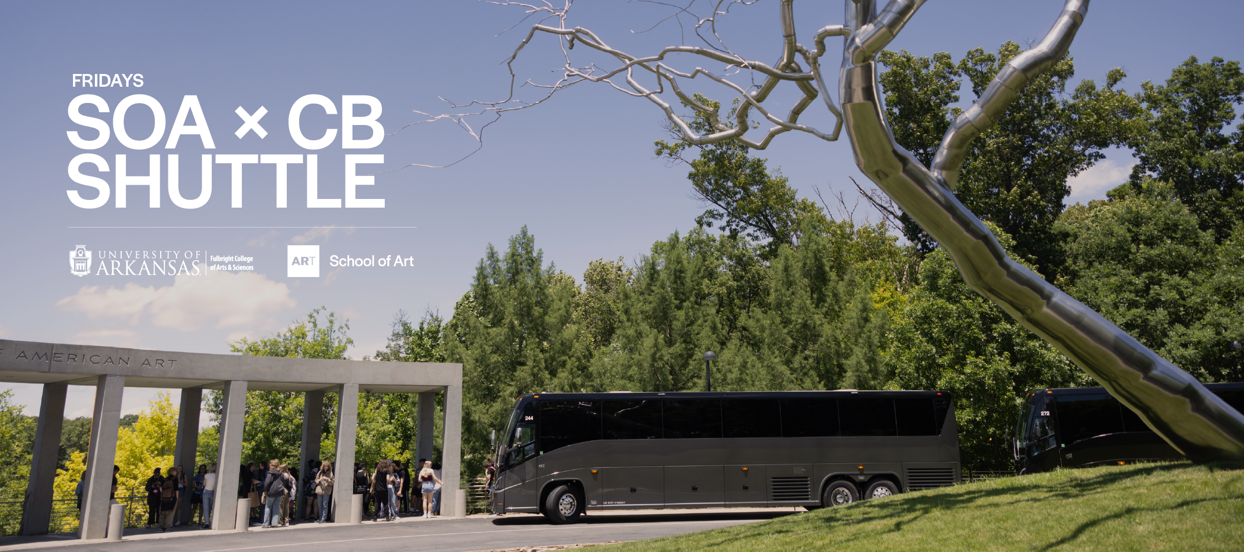 Crystal Bridges Museum front entrance with silver tree and shuttle bus